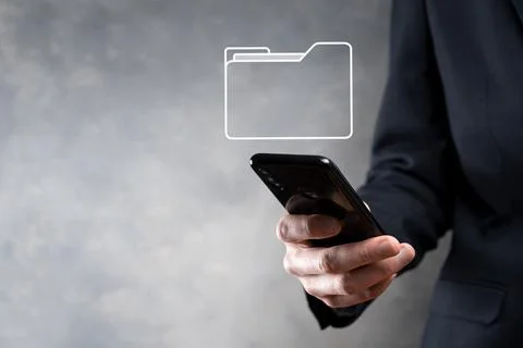 Businessman hold folder icon.Document Management System or DMS setup by IT co 写真素材