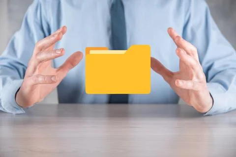 Businessman hold folder icon.Document Management System or DMS setup by IT co Stockfoto's