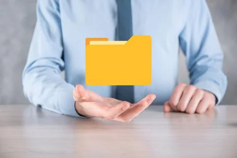Businessman hold folder icon.Document Management System or DMS setup by IT co Stockfoto's
