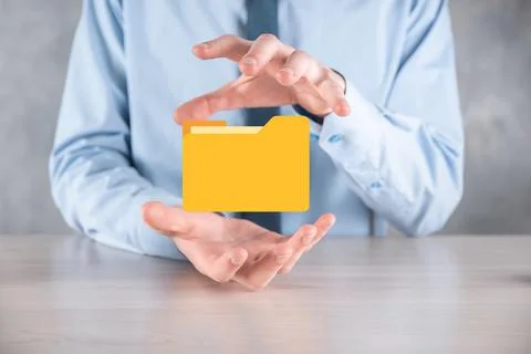 Businessman hold folder icon.Document Management System or DMS setup by IT co 写真素材