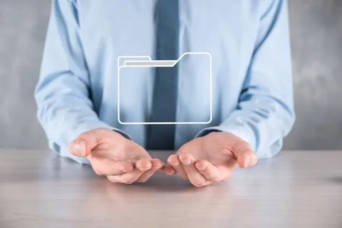 Businessman hold folder icon.Document Management System or DMS setup by IT co 스톡 사진