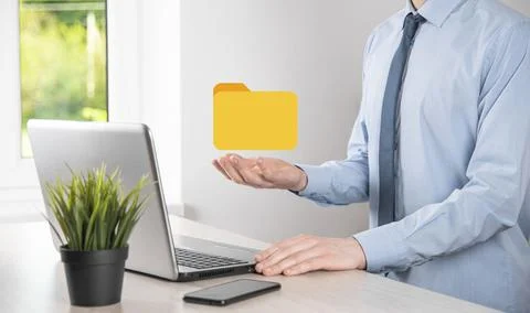 Businessman hold folder icon.Document Management System or DMS setup by IT co 写真素材