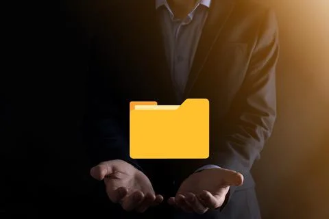Businessman hold folder icon.Document Management System or DMS setup by IT co Stockfoto's