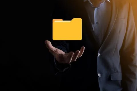 Businessman hold folder icon.Document Management System or DMS setup by IT co 写真素材
