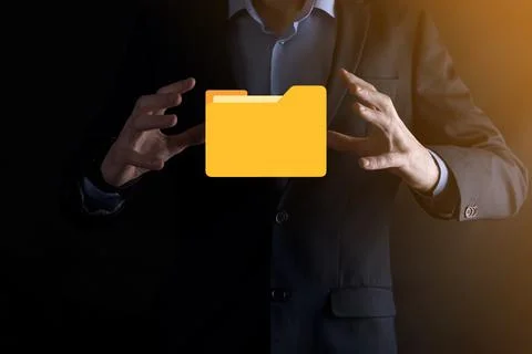 Businessman hold folder icon.Document Management System or DMS setup by IT co 写真素材