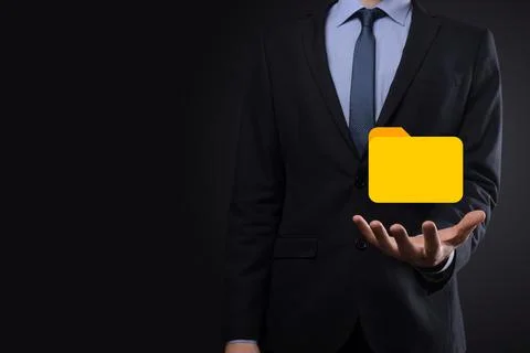 Businessman hold folder icon.Document Management System or DMS setup by IT co 写真素材