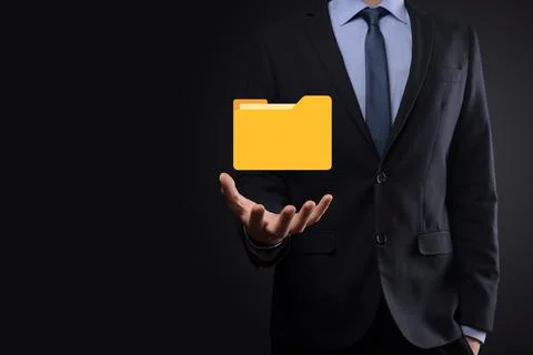 Businessman hold folder icon.Document Management System or DMS setup by IT co Stockfoto's