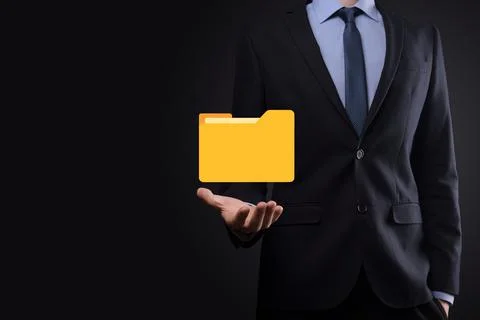 Businessman hold folder icon.Document Management System or DMS setup by IT co Stock Photos