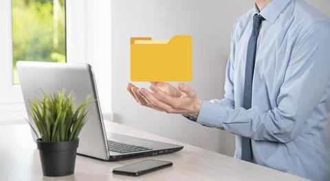 Businessman hold folder icon.Document Management System or DMS setup by IT co 写真素材