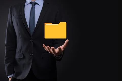 Businessman hold folder icon.Document Management System or DMS setup by IT co Stockfoto's