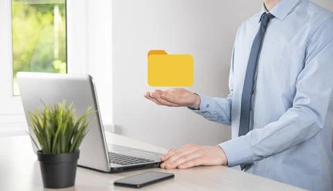 Businessman hold folder icon.Document Management System or DMS setup by IT co Stockfoto's