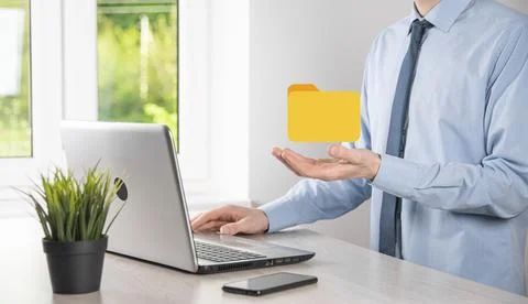 Businessman hold folder icon.Document Management System or DMS setup by IT co Stockfoto's