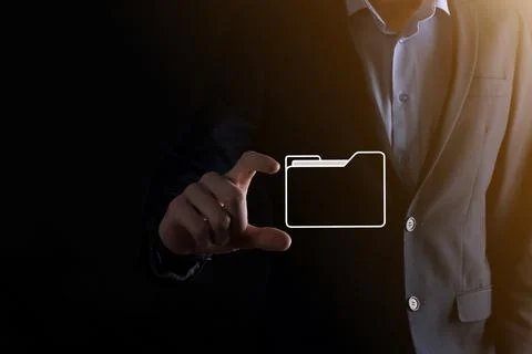 Businessman hold folder icon.Document Management System or DMS setup by IT co 写真素材