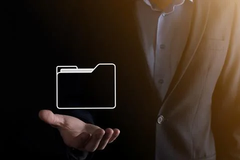 Businessman hold folder icon.Document Management System or DMS setup by IT co Photos