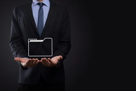 Businessman hold folder icon.Document Management System or DMS setup by IT co 写真素材