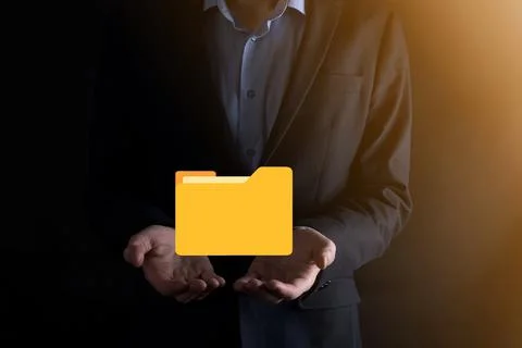 Businessman hold folder icon.Document Management System or DMS setup by IT co 写真素材