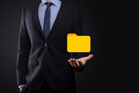 Businessman hold folder icon.Document Management System or DMS setup by IT co 写真素材