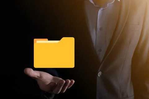 Businessman hold folder icon.Document Management System or DMS setup by IT co 스톡 사진