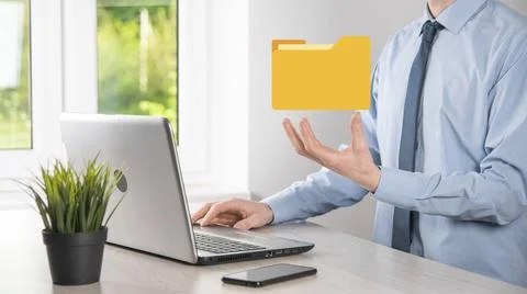 Businessman hold folder icon.Document Management System or DMS setup by IT co 写真素材
