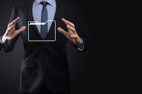 Businessman hold folder icon.Document Management System or DMS setup by IT co 库存照片