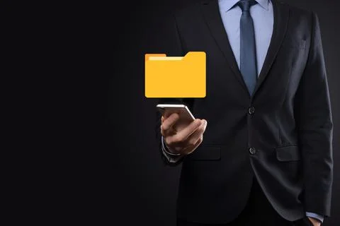 Businessman hold folder icon.Document Management System or DMS setup by IT co Stockfoto's
