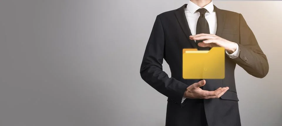 Businessman hold folder icon.Document Management System or DMS setup by IT co Stockfoto's