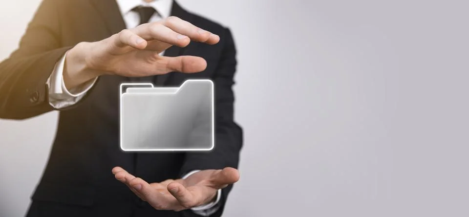 Businessman hold folder icon.Document Management System or DMS setup by IT co 写真素材
