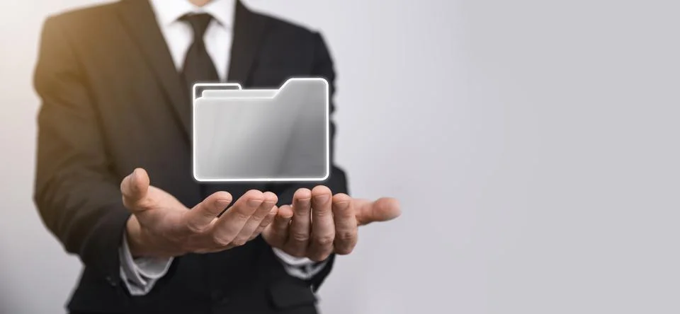 Businessman hold folder icon.Document Management System or DMS setup by IT co 写真素材