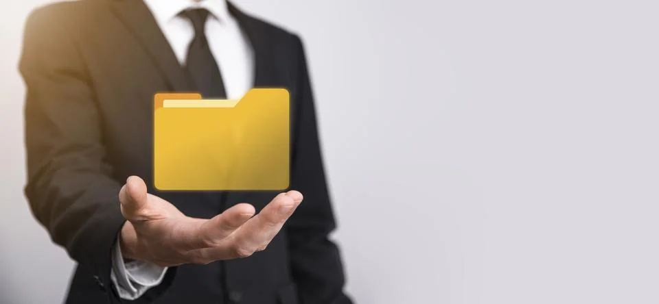 Businessman hold folder icon.Document Management System or DMS setup by IT co 写真素材