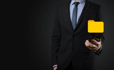Businessman hold folder icon.Document Management System or DMS setup by IT co 写真素材
