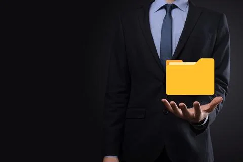 Businessman hold folder icon.Document Management System or DMS setup by IT co Stockfoto's