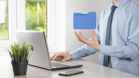Businessman hold folder icon.Document Management System or DMS setup by IT co 写真素材