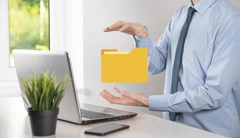 Businessman hold folder icon.Document Management System or DMS setup by IT co Stockfoto's