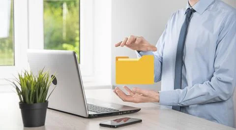 Businessman hold folder icon.Document Management System or DMS setup by IT co 写真素材