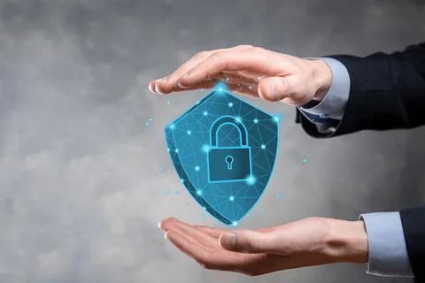 Businessman hold low poly polygon shield with a padlock icon.Secure Access Sy Stock Photos