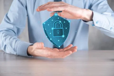 Businessman hold low poly polygon shield with a padlock icon.Secure Access Sy Stock Photos