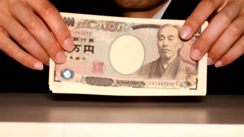 A businessman holding banknotes 스톡 동영상 334873115