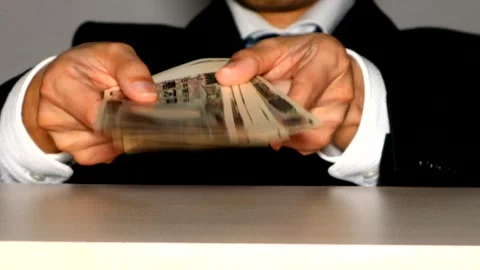 A businessman holding banknotes Stock Footage 334912129