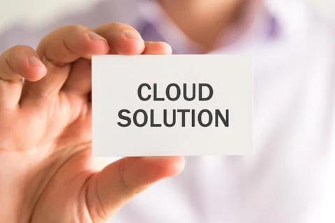 Businessman holding a card with CLOUD SOLUTION message Stock Photos