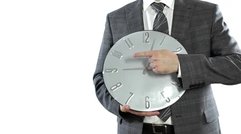 Businessman holding a clock Stock Footage 7752346
