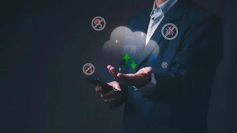 Businessman holding a cloud computing symbol with icons 写真素材