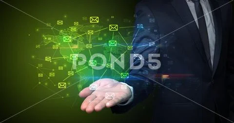 Businessman holding communication symbols Stock Photos
