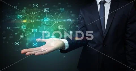 Businessman holding communication symbols Stock Photos