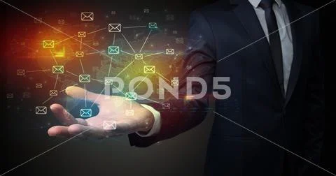 Businessman holding communication symbols Stock Photos