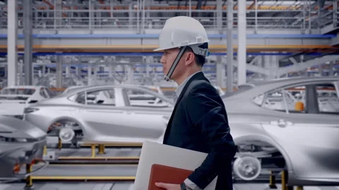 Businessman Holding Computer While Walking In Car Factory Stock Footage 331630423