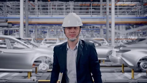 Businessman Holding Computer While Walking In Car Factory Stock Footage 331630560