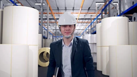 Businessman Holding Computer While Walking at Polymer Plant Stock Footage 334521556
