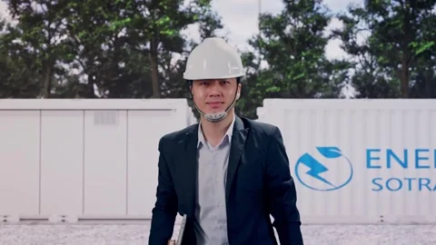 Businessman Holding Computer While Walking with Energy Storage Stock Footage 337811446