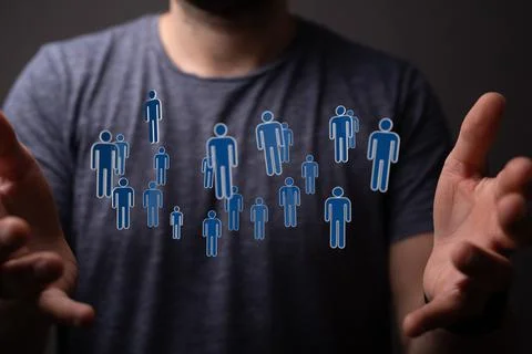 Businessman holding a floating digital render of profile icons-networking concep Stock Photos