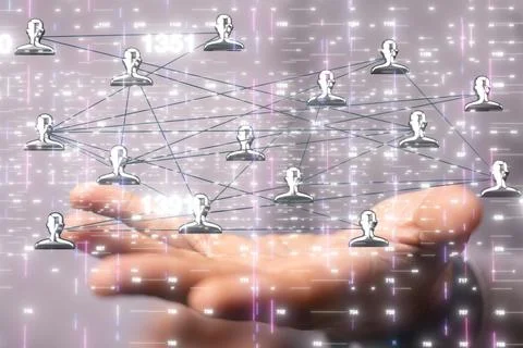 Businessman holding a floating digital render of interconnected profile icons-ne Stock Photos